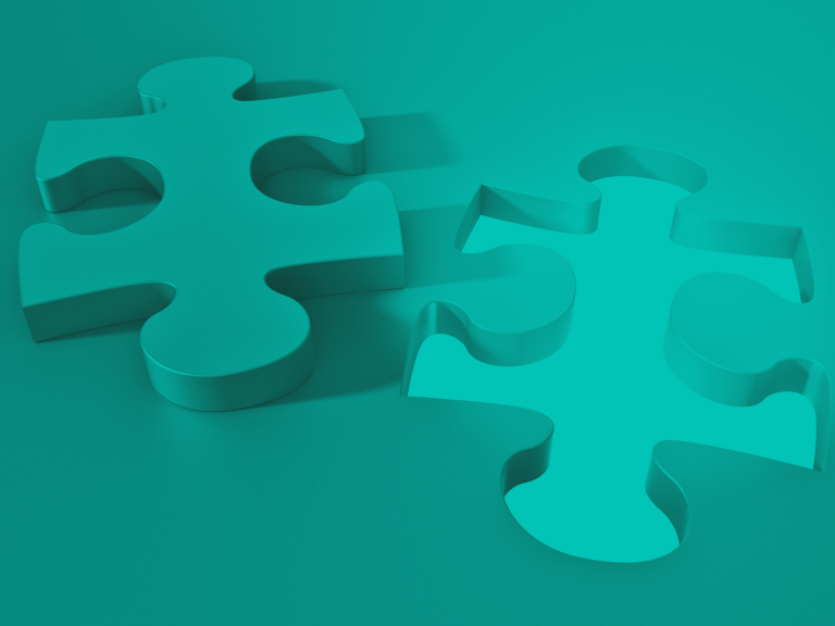Two teal puzzle pieces on a matching teal background.