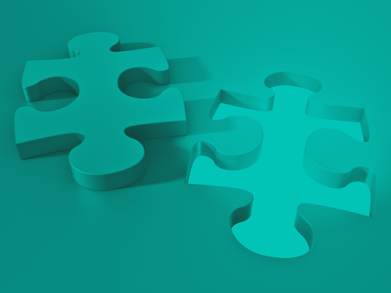 Two teal puzzle pieces on a matching teal background.
