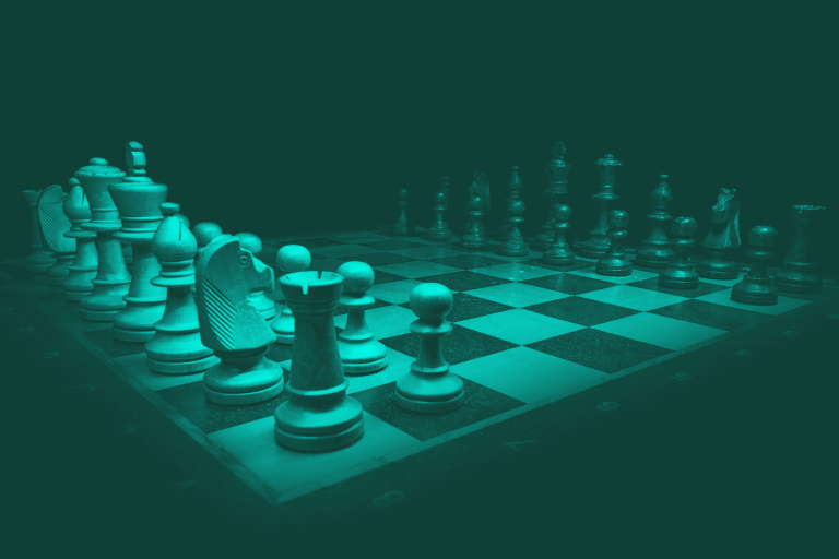 A chessboard with pieces arranged in a strategic formation. Symbolising strategic complexity