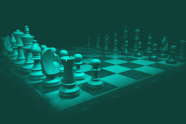 A chessboard with pieces arranged in a strategic formation. Symbolising strategic complexity